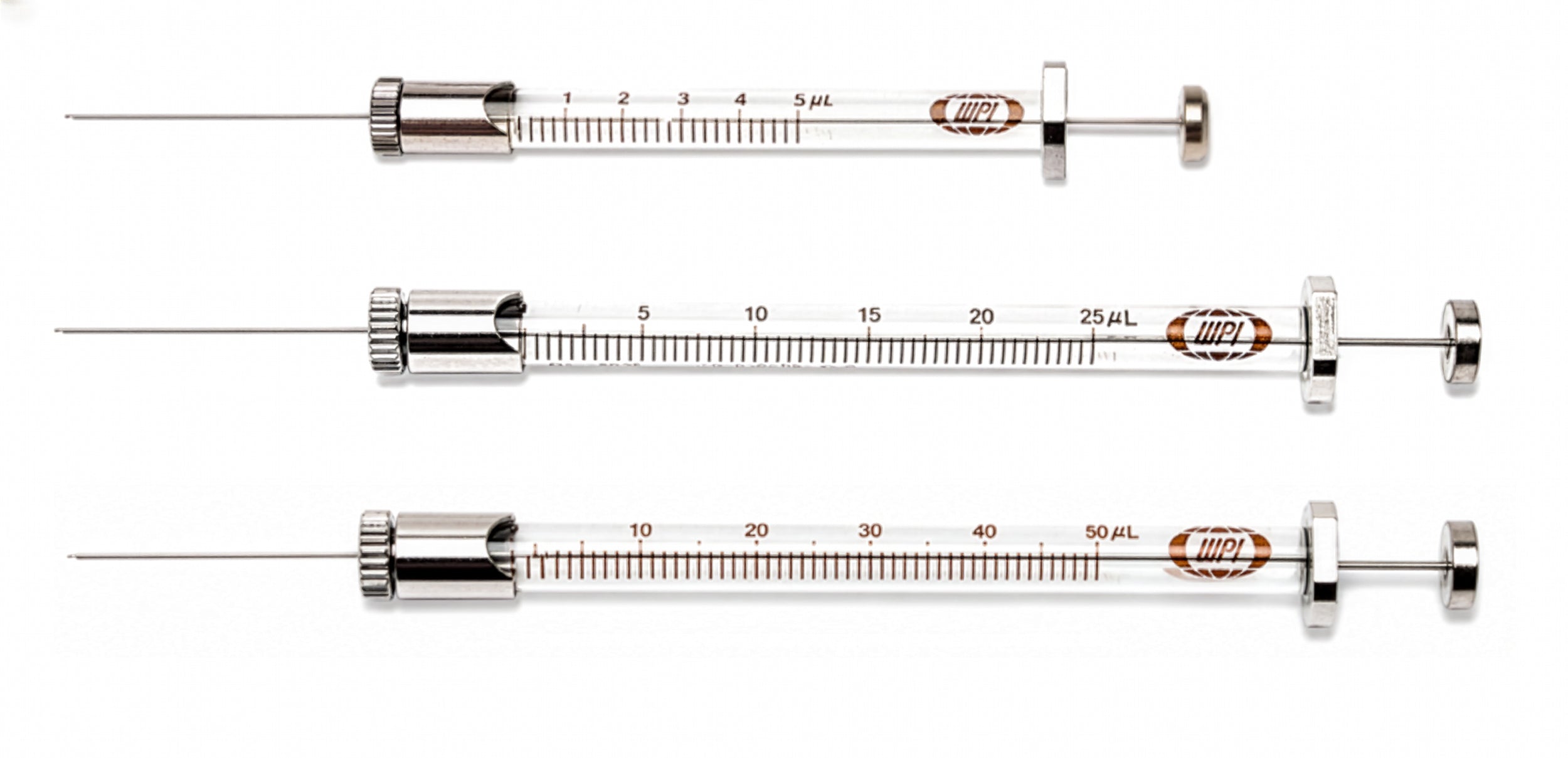 Three new NanoFil syringes with measurement scales on a white background