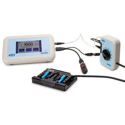 A medical monitoring device set on a white background, featuring a digital EKG monitor, a pulse oximeter, a pulse oximeter controller, and a multi-lead ECG electrode gel pad.