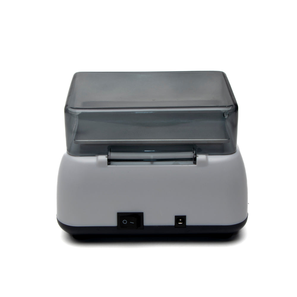 Gray machine with a transparent lid on a white background